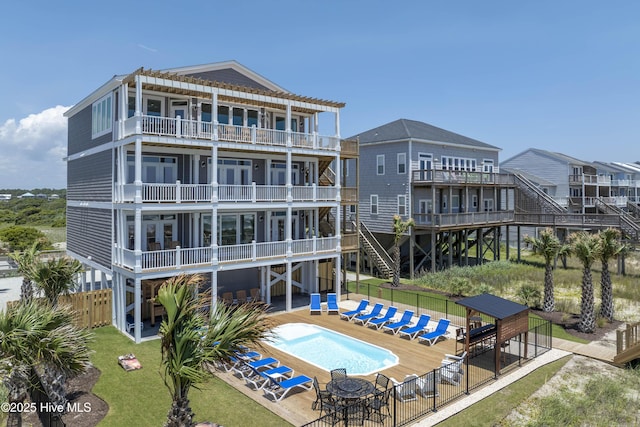 1326 New River Inlet Rd, North Topsail Beach, NC 28460 - rear view of property featuring a balcony, stairs, and a patio