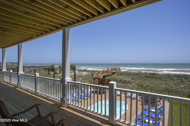 1326 New River Inlet Rd, North Topsail Beach, NC 28460 - balcony featuring a beach view, view of pool, and a deck with water view