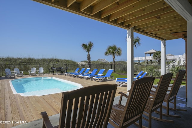 1326 New River Inlet Rd, North Topsail Beach, NC 28460 - view of swimming pool with a fenced backyard and a deck