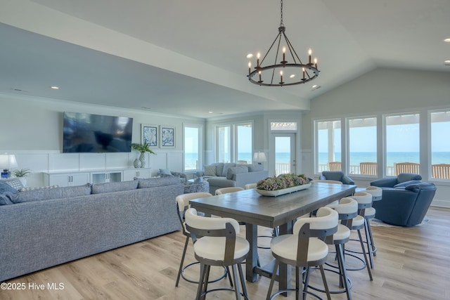 1326 New River Inlet Rd, North Topsail Beach, NC 28460 - dining area with plenty of natural light, a chandelier, vaulted ceiling, light wood-style floors, and recessed lighting