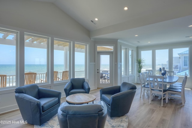 1326 New River Inlet Rd, North Topsail Beach, NC 28460 - living room featuring light wood-type flooring, healthy amount of natural light, lofted ceiling, recessed lighting, and a water view