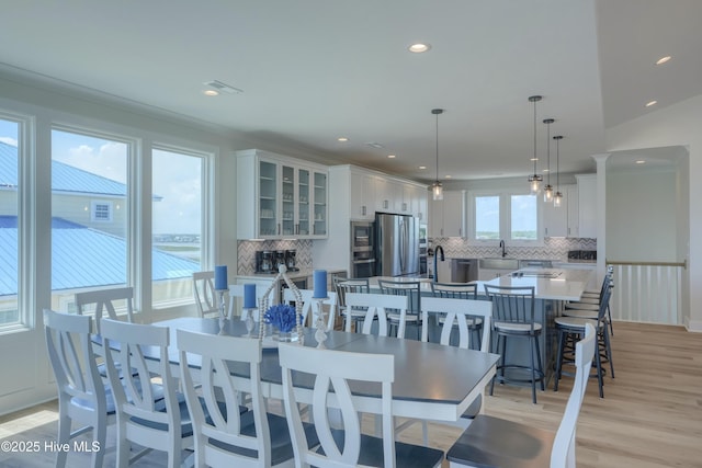 1326 New River Inlet Rd, North Topsail Beach, NC 28460 - dining space with light wood-style floors and recessed lighting