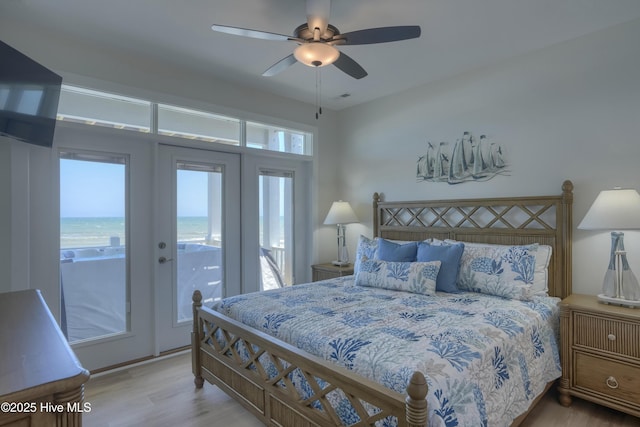 1326 New River Inlet Rd, North Topsail Beach, NC 28460 - bedroom featuring access to exterior, wood finished floors, and ceiling fan
