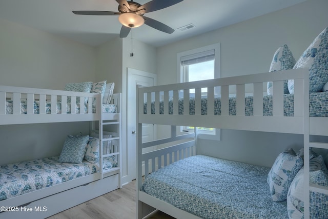 1326 New River Inlet Rd, North Topsail Beach, NC 28460 - bedroom featuring wood finished floors and ceiling fan