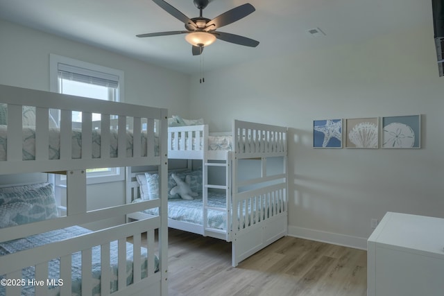1326 New River Inlet Rd, North Topsail Beach, NC 28460 - bedroom featuring multiple windows and wood finished floors