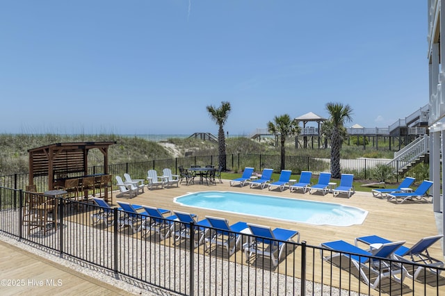 1326 New River Inlet Rd, North Topsail Beach, NC 28460 - community pool featuring a wooden deck and outdoor dining area