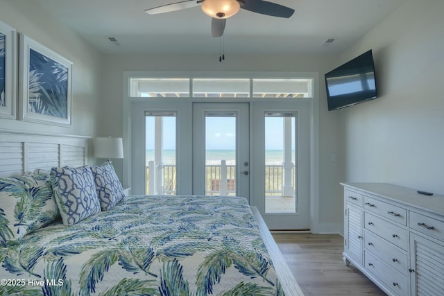 1326 New River Inlet Rd, North Topsail Beach, NC 28460 - bedroom with access to outside, french doors, light wood finished floors, and ceiling fan