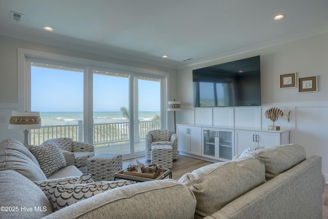 1326 New River Inlet Rd, North Topsail Beach, NC 28460 - living area featuring wood finished floors, ornamental molding, and recessed lighting