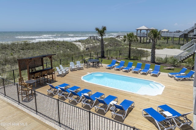 1326 New River Inlet Rd, North Topsail Beach, NC 28460 - view of pool with a deck with water view, view of nearby beach, and outdoor dining space