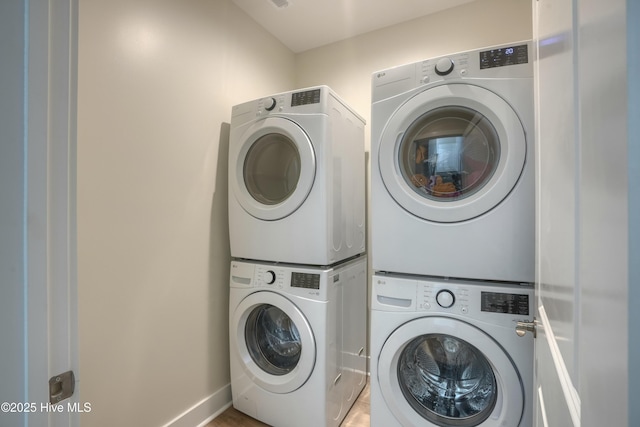 1326 New River Inlet Rd, North Topsail Beach, NC 28460 - washroom with estacked washer and dryer and baseboards