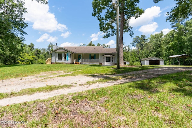 5025 NC Highway 55 E, New Bern, NC 28560 - single story home with covered porch, an outbuilding, a chimney, a front lawn, and a detached carport