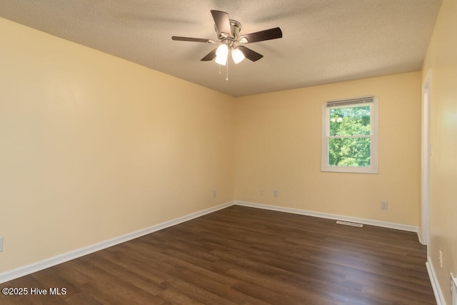 5025 NC Highway 55 E, New Bern, NC 28560 - spare room with dark wood-type flooring, ceiling fan, and a textured ceiling