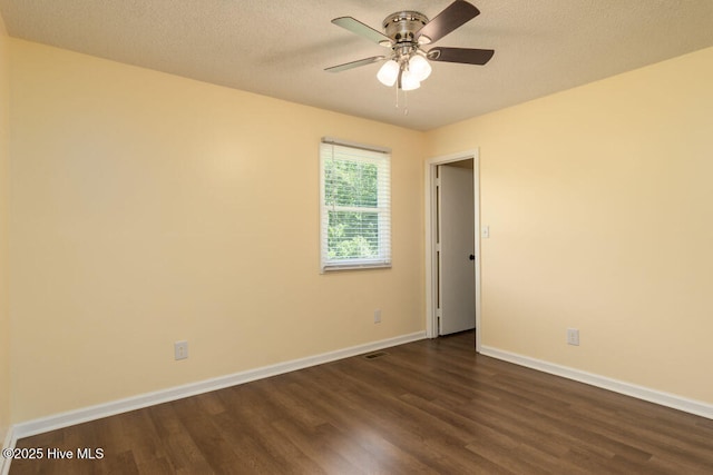 5025 NC Highway 55 E, New Bern, NC 28560 - empty room with dark wood-type flooring, a ceiling fan, and a textured ceiling