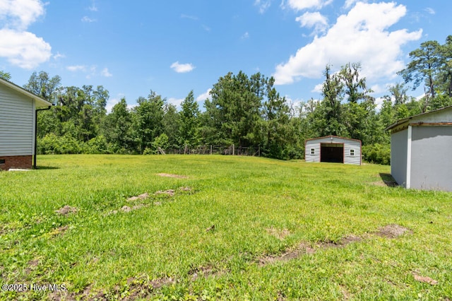 5025 NC Highway 55 E, New Bern, NC 28560 - view of green lawn with a garage and an outbuilding