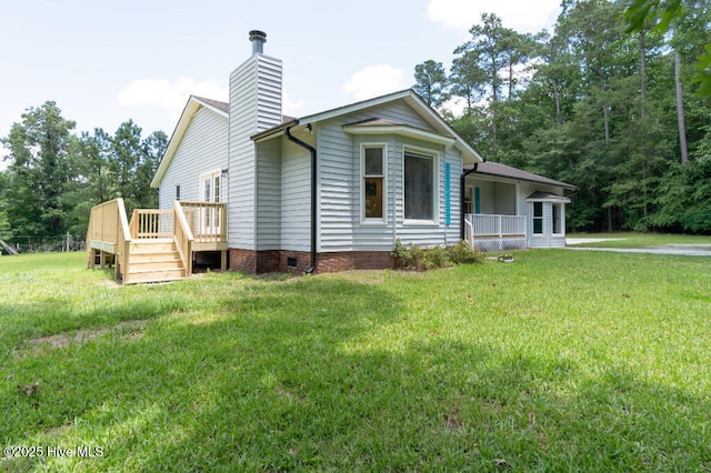 5025 NC Highway 55 E, New Bern, NC 28560 - view of front of house featuring a chimney, a front lawn, crawl space, and a wooden deck