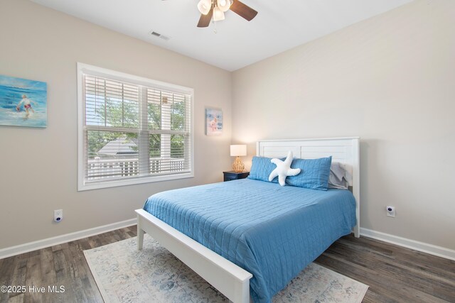 109 SW 17th St, Oak Island, NC 28465 - bedroom featuring wood finished floors and a ceiling fan