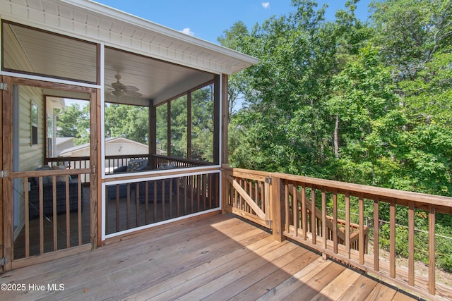 109 SW 17th St, Oak Island, NC 28465 - wooden deck featuring a ceiling fan and a sunroom