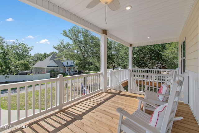 109 SW 17th St, Oak Island, NC 28465 - wooden deck featuring a ceiling fan