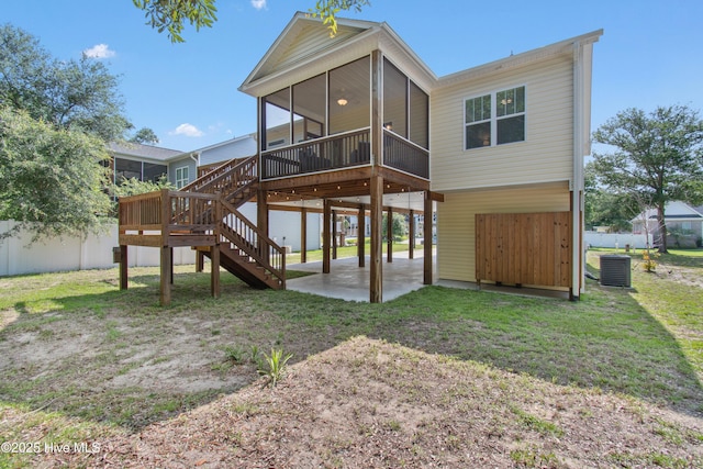 109 SW 17th St, Oak Island, NC 28465 - rear view of house with a sunroom, a patio area, and stairs