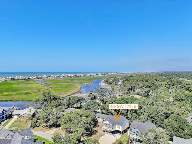 109 SW 17th St, Oak Island, NC 28465 - aerial perspective of suburban area featuring a nearby body of water