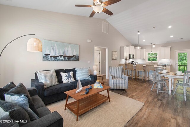109 SW 17th St, Oak Island, NC 28465 - living area featuring ceiling fan, wood finished floors, high vaulted ceiling, and recessed lighting