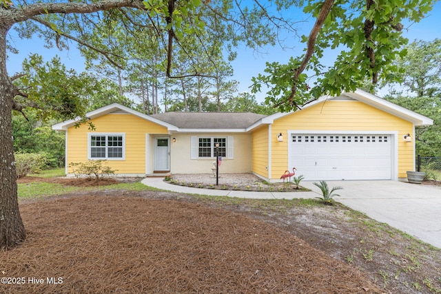 383 Red Fox St NW, Shallotte, NC 28470 - ranch-style house featuring an attached garage, driveway, and roof with shingles