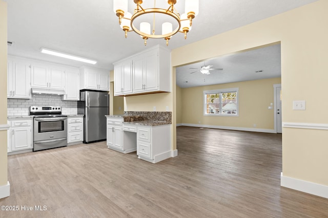 383 Red Fox St NW, Shallotte, NC 28470 - kitchen with stainless steel appliances, under cabinet range hood, light wood-style flooring, a chandelier, and open floor plan