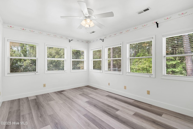383 Red Fox St NW, Shallotte, NC 28470 - unfurnished sunroom featuring plenty of natural light and wood finished floors
