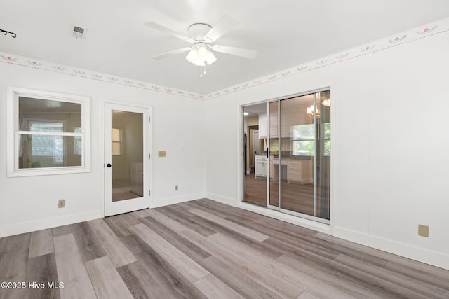 383 Red Fox St NW, Shallotte, NC 28470 - unfurnished room featuring wood finished floors and a ceiling fan