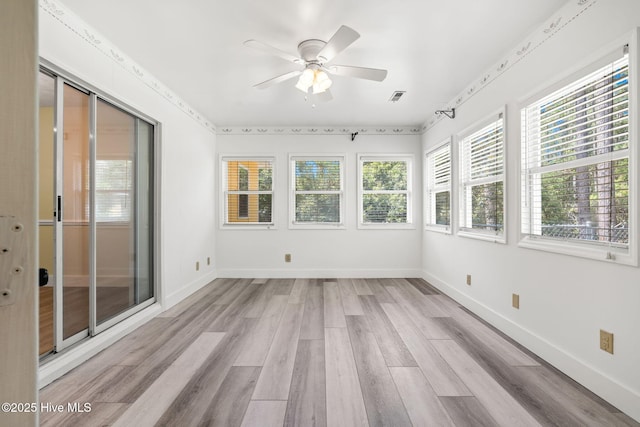 383 Red Fox St NW, Shallotte, NC 28470 - unfurnished sunroom with wood finished floors and baseboards