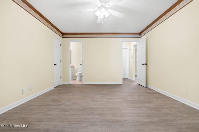 383 Red Fox St NW, Shallotte, NC 28470 - spare room featuring crown molding, ceiling fan, and wood finished floors