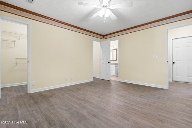 383 Red Fox St NW, Shallotte, NC 28470 - empty room with ornamental molding, wood finished floors, and a ceiling fan