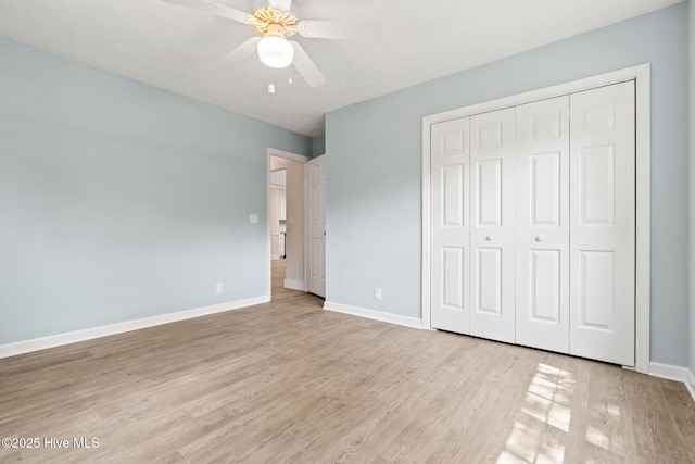 383 Red Fox St NW, Shallotte, NC 28470 - unfurnished bedroom featuring light wood finished floors, a closet, and a ceiling fan