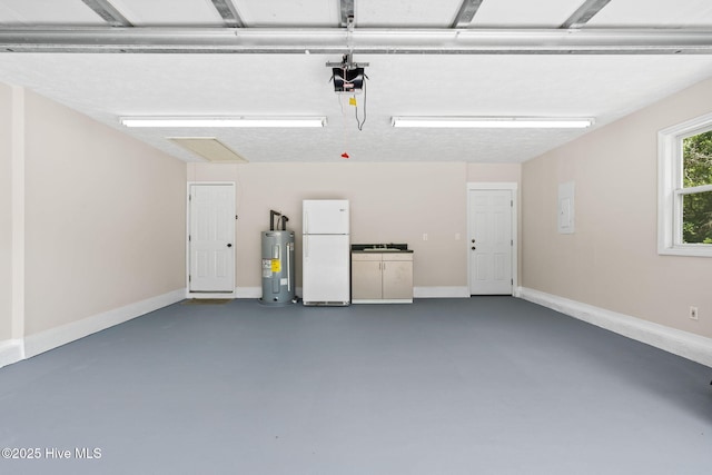 383 Red Fox St NW, Shallotte, NC 28470 - garage with freestanding refrigerator, electric water heater, a garage door opener, and electric panel