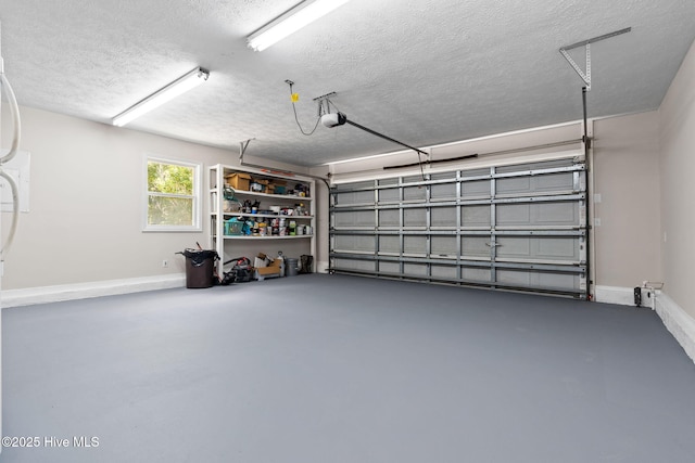 383 Red Fox St NW, Shallotte, NC 28470 - garage featuring a garage door opener and baseboards
