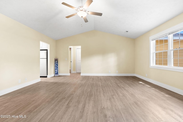 383 Red Fox St NW, Shallotte, NC 28470 - unfurnished living room featuring a ceiling fan, lofted ceiling, and light wood-style flooring