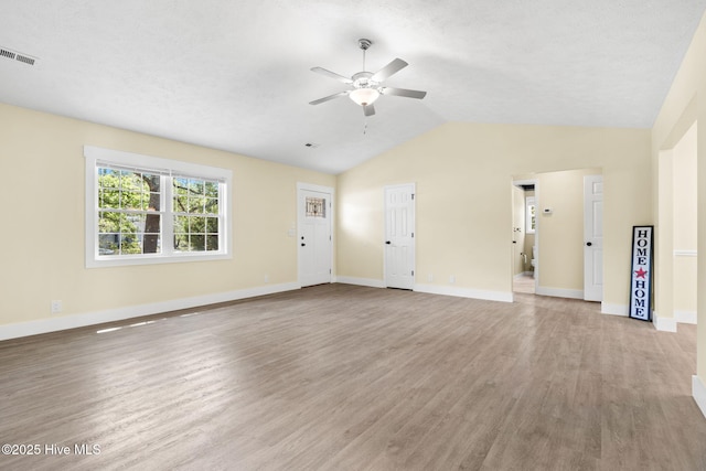 383 Red Fox St NW, Shallotte, NC 28470 - unfurnished living room featuring a ceiling fan, wood finished floors, and lofted ceiling