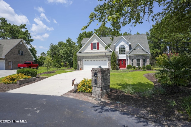 107 Sea Turtle Cv, Sneads Ferry, NC 28460 - traditional home featuring concrete driveway, a front lawn, a garage, and brick siding