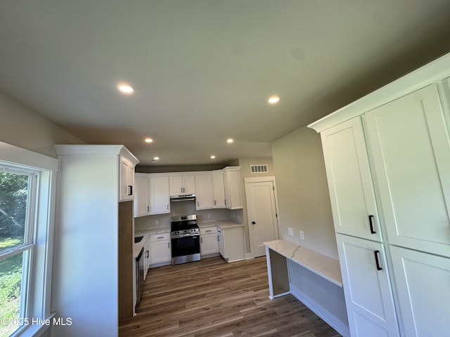 317 Whitfield Dr, Goldsboro, NC 27530 - kitchen with stainless steel electric range oven, dark wood-type flooring, white cabinets, recessed lighting, and under cabinet range hood