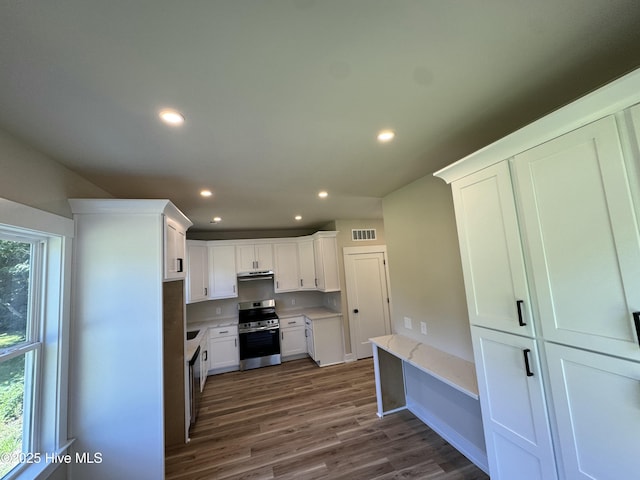 317 Whitfield Dr, Goldsboro, NC 27530 - kitchen featuring stainless steel range with electric stovetop, dark wood-style floors, white cabinets, recessed lighting, and under cabinet range hood