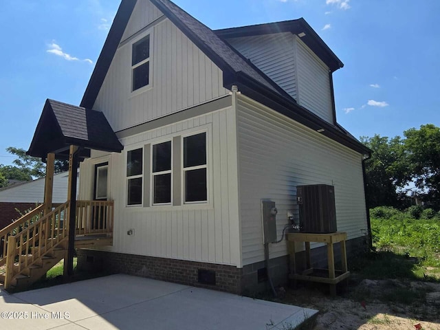 317 Whitfield Dr, Goldsboro, NC 27530 - back of house with crawl space, a shingled roof, and a patio