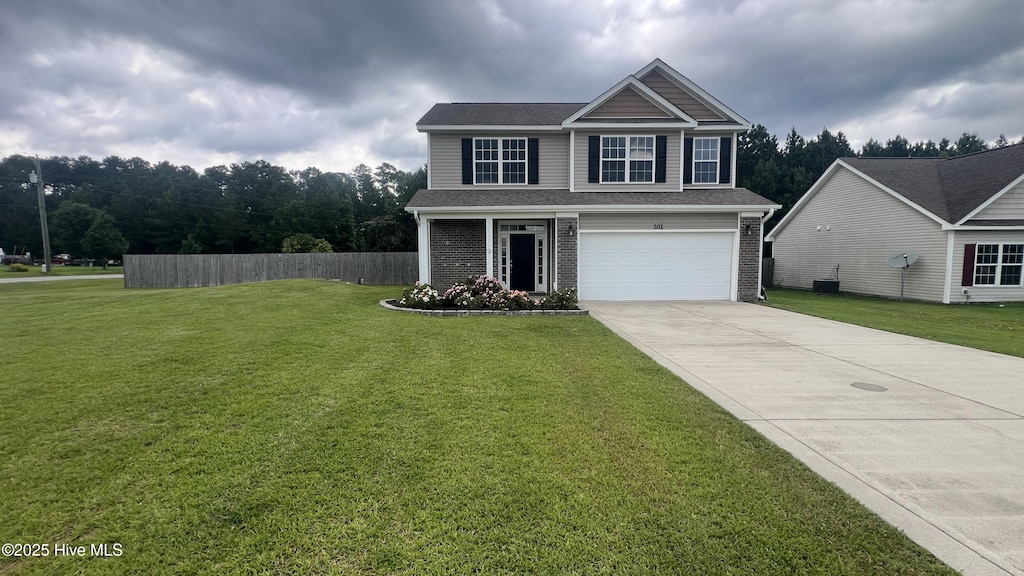 301 De Anza Ct, Maysville, NC 28555 - view of front facade with concrete driveway, a garage, and brick siding