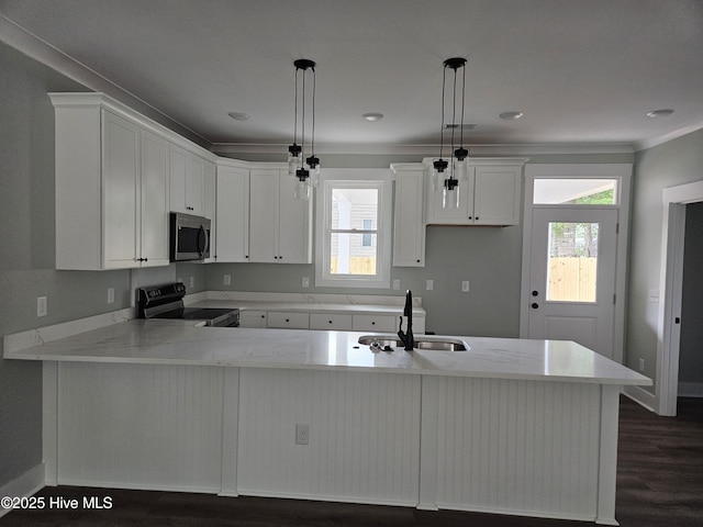 7151 Dale Ave SW, Ocean Isle Beach, NC 28469 - kitchen with stainless steel microwave, electric stove, dark wood-style flooring, a peninsula, and light stone counters