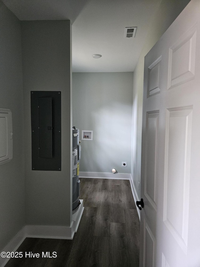 7151 Dale Ave SW, Ocean Isle Beach, NC 28469 - corridor featuring electric panel and dark wood finished floors