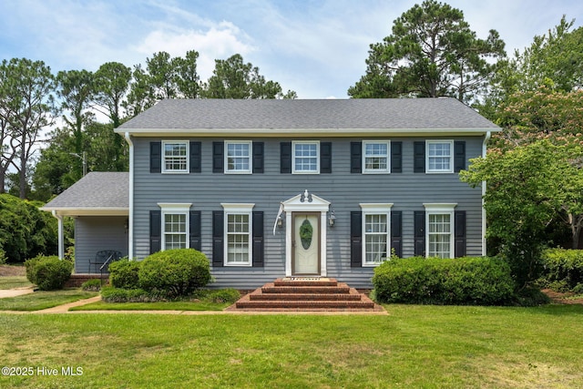 429 Tanbridge Rd, Wilmington, NC 28405 - colonial-style house featuring a front lawn and a shingled roof