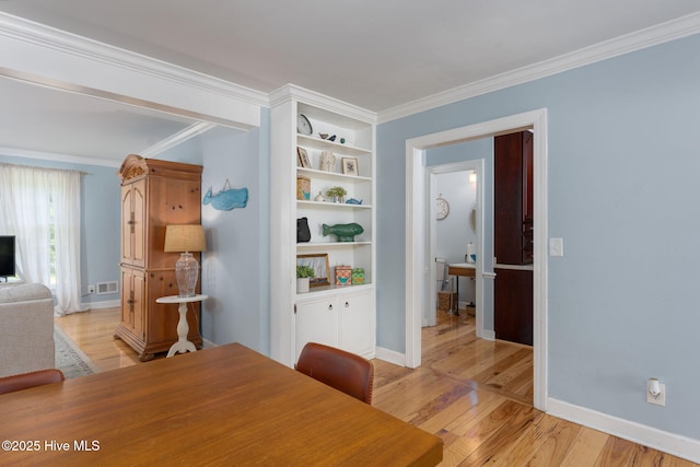 429 Tanbridge Rd, Wilmington, NC 28405 - dining room featuring ornamental molding and light wood-style flooring
