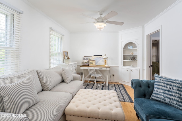 429 Tanbridge Rd, Wilmington, NC 28405 - living area with crown molding, ceiling fan, wood finished floors, and built in features