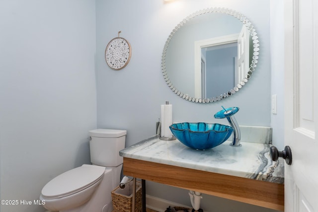 429 Tanbridge Rd, Wilmington, NC 28405 - half bathroom featuring a sink and toilet