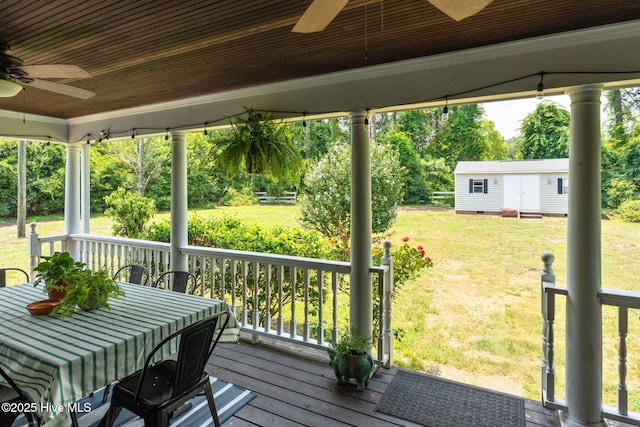 429 Tanbridge Rd, Wilmington, NC 28405 - wooden deck featuring a ceiling fan, a lawn, and an outdoor structure