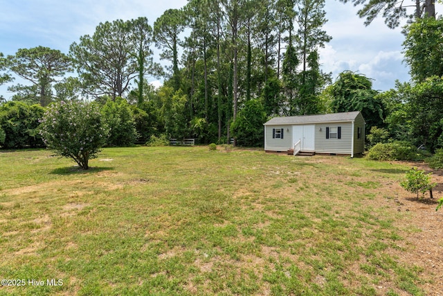 429 Tanbridge Rd, Wilmington, NC 28405 - view of grassy yard featuring entry steps and an outdoor structure